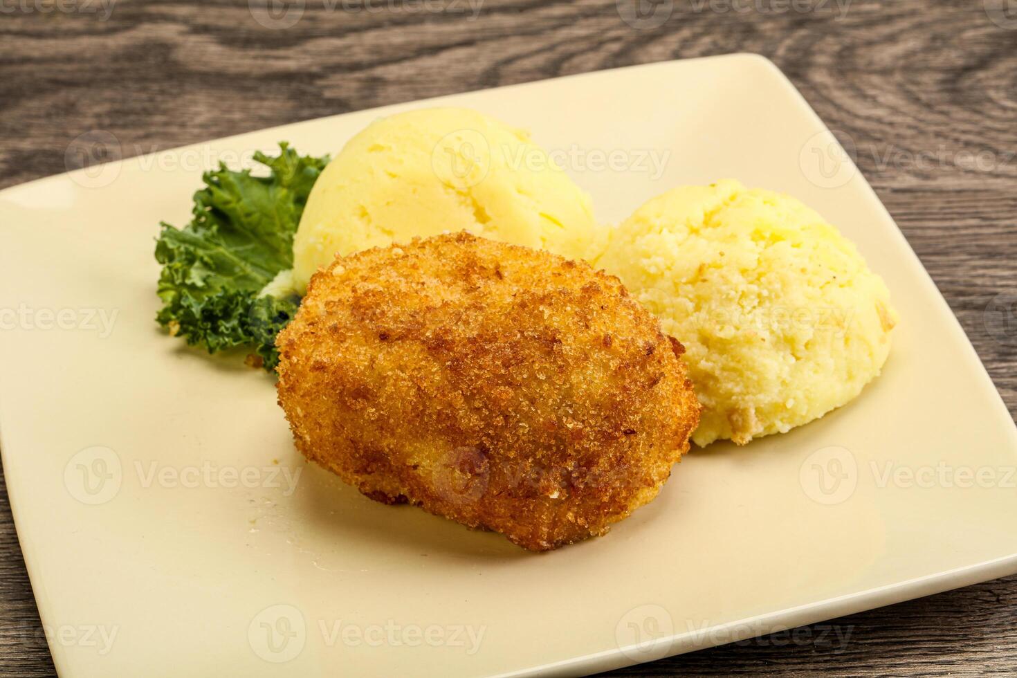 Crispy chicken cutlet with mashed potato photo