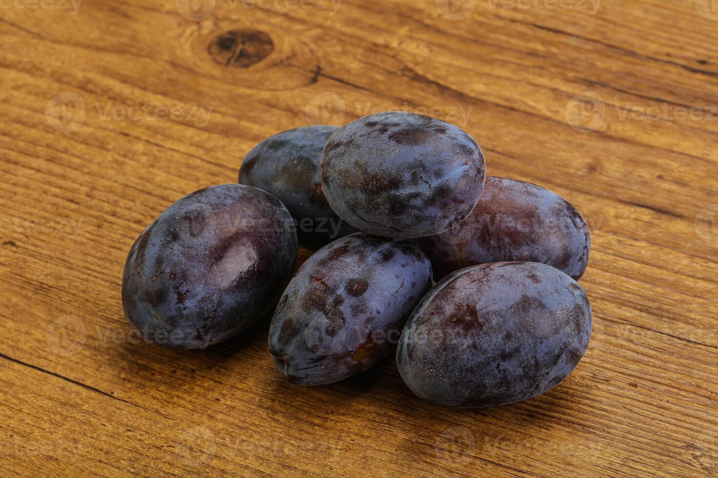 Purple sweet ripe plum heap photo