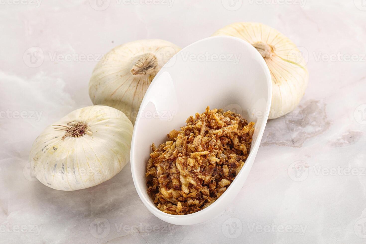 Dried roasted onion flakes for culinary photo