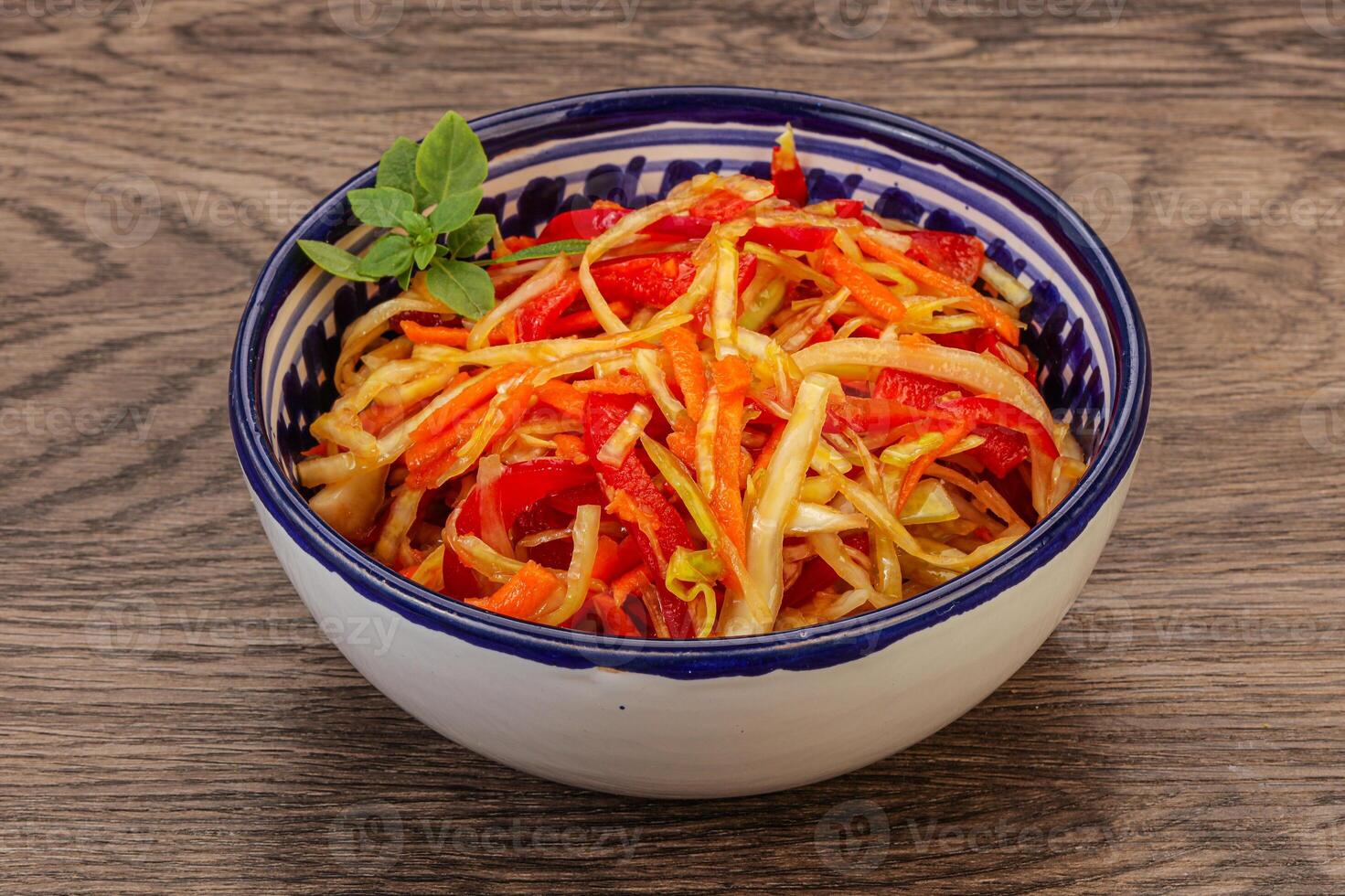 Cabbage salad with carrot and pepper photo