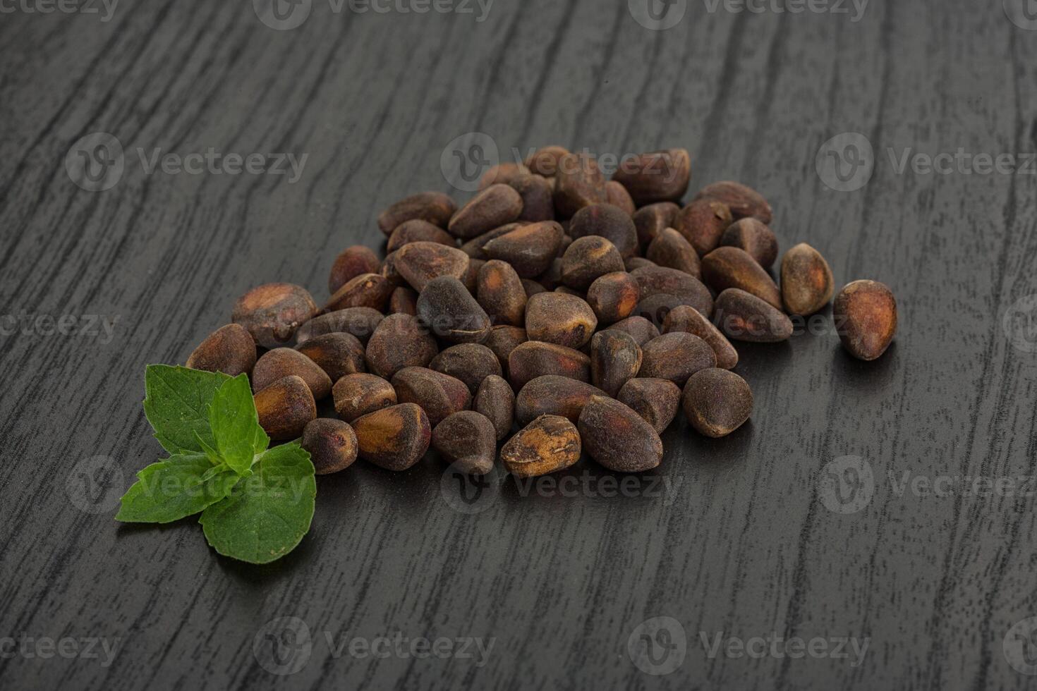 Cedar nuts over board photo