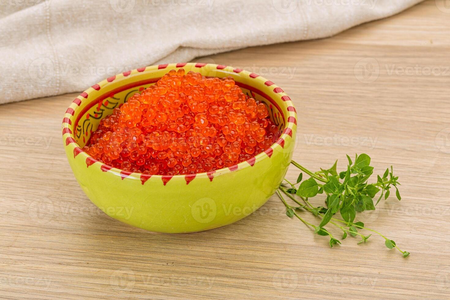 Red caviar in the plate photo