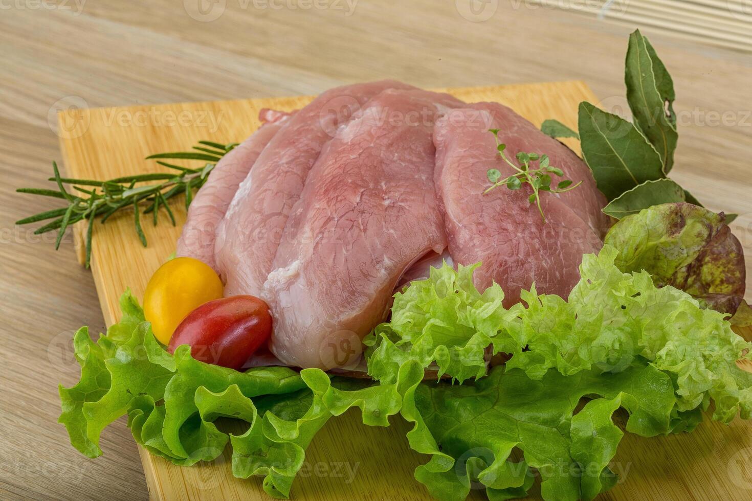 Raw pork schnitzel photo