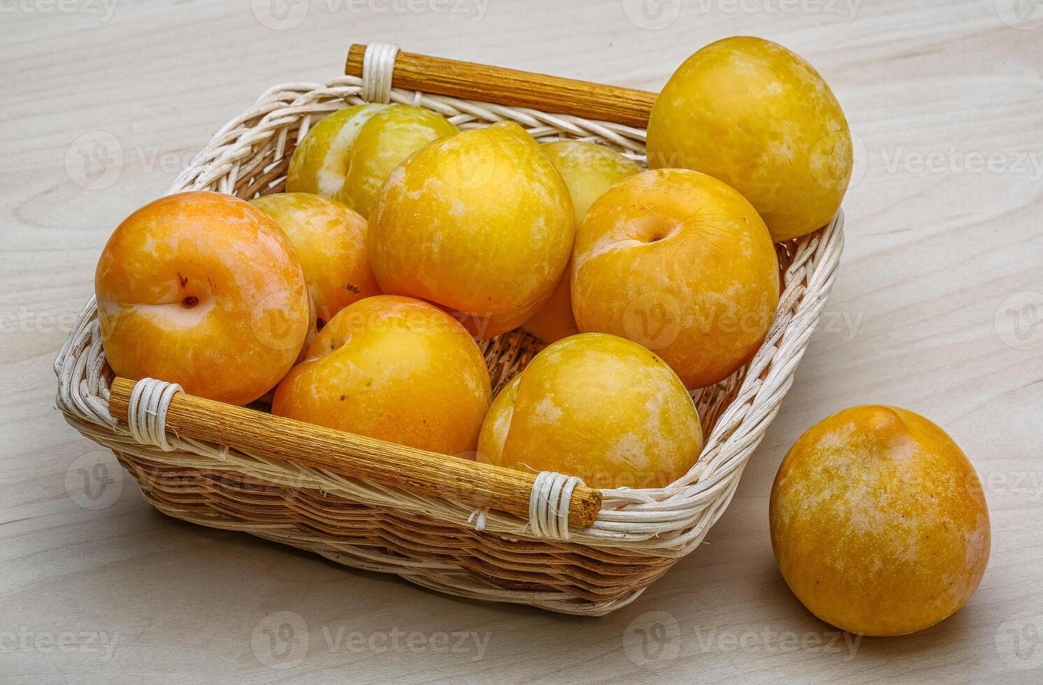 Yellow plums in the bowl photo