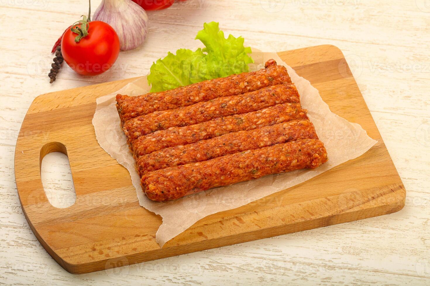 Raw beef sausages photo