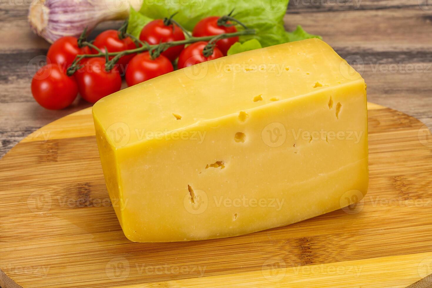 Hard yellow tasty cheese brick photo