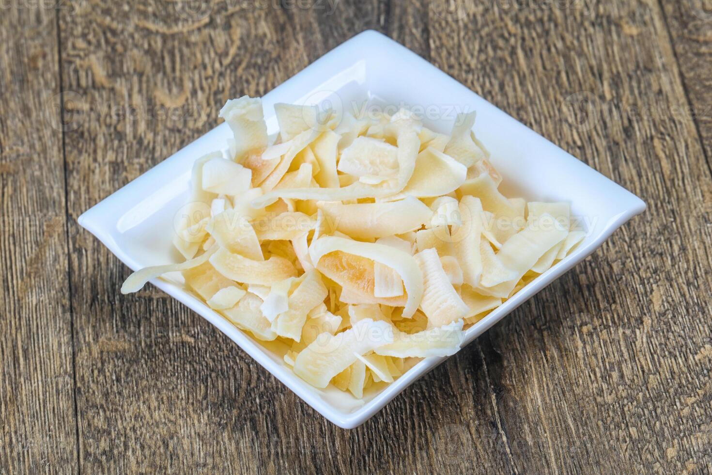 Coconut dry chips in the bowl photo