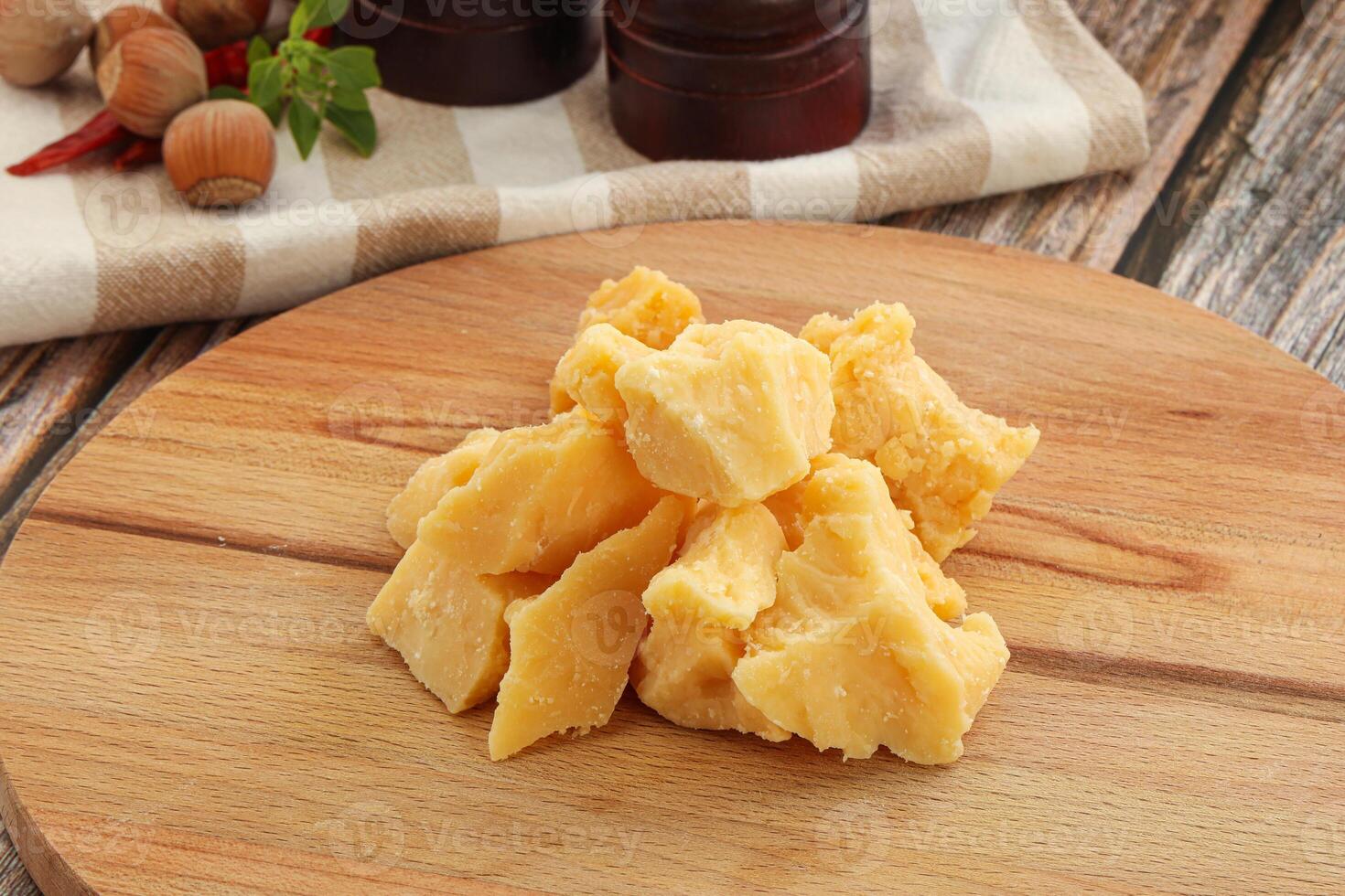 Crushed hard parmesan cheese pieces photo