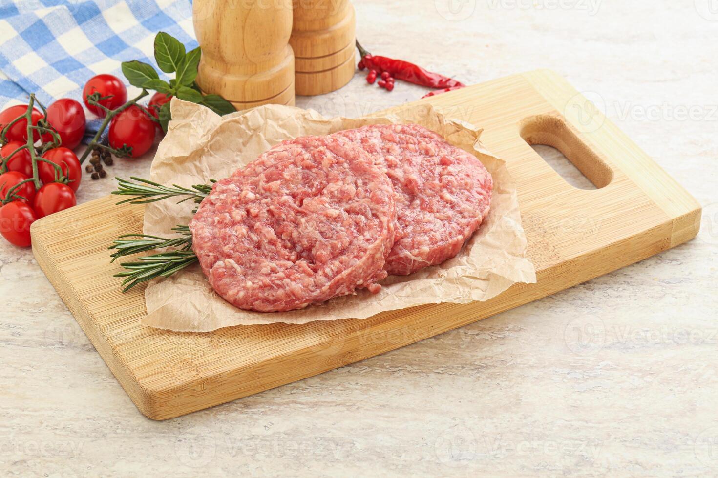 Raw pork cutlet for burger photo