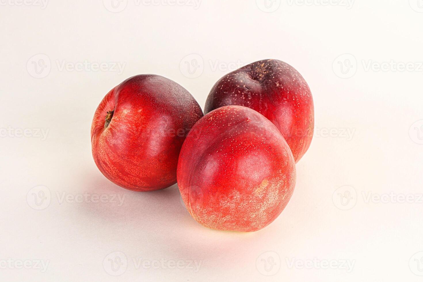 Ripe sweet juicy nectarines heap photo