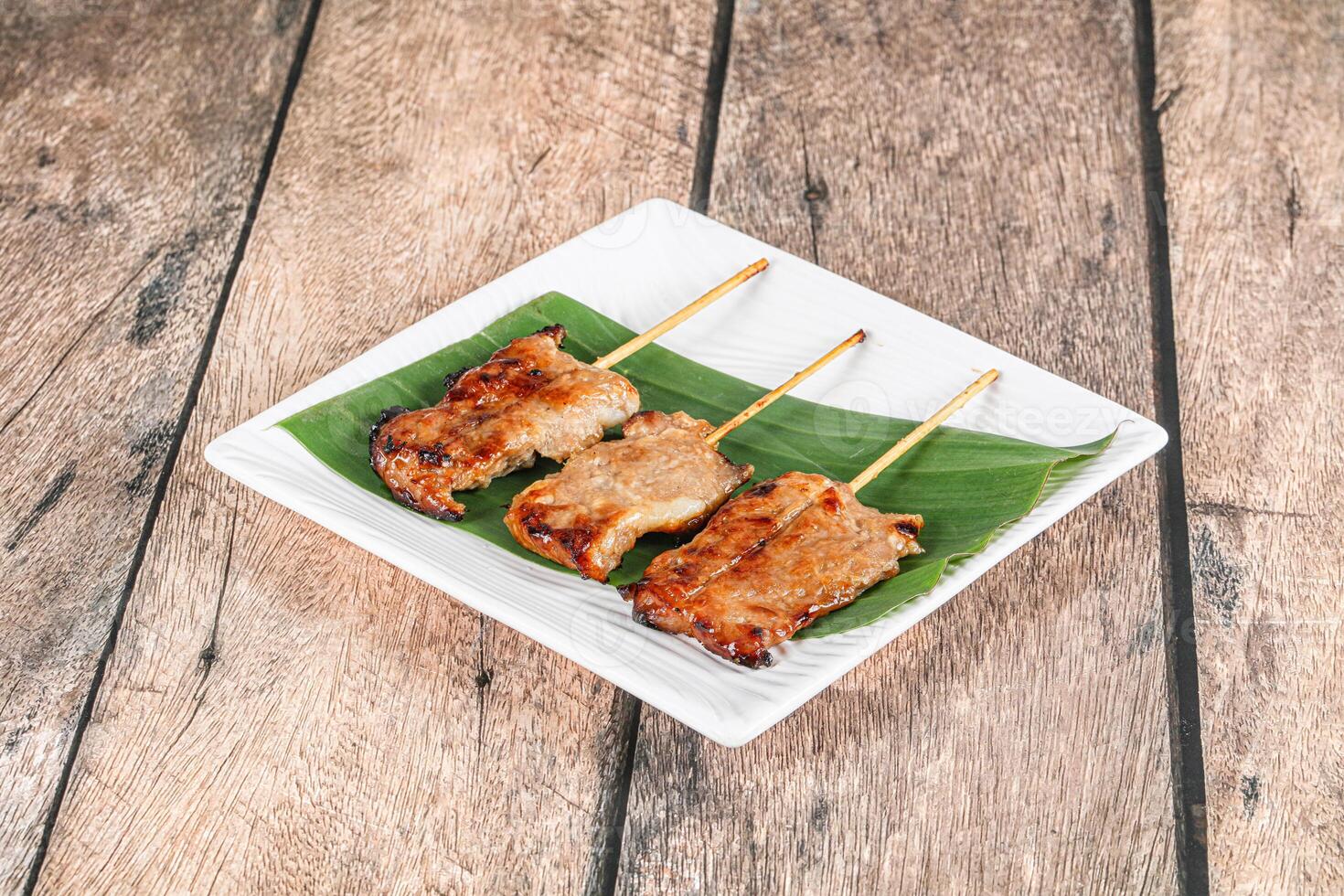 Thai cuisine - grilled pork skewer photo