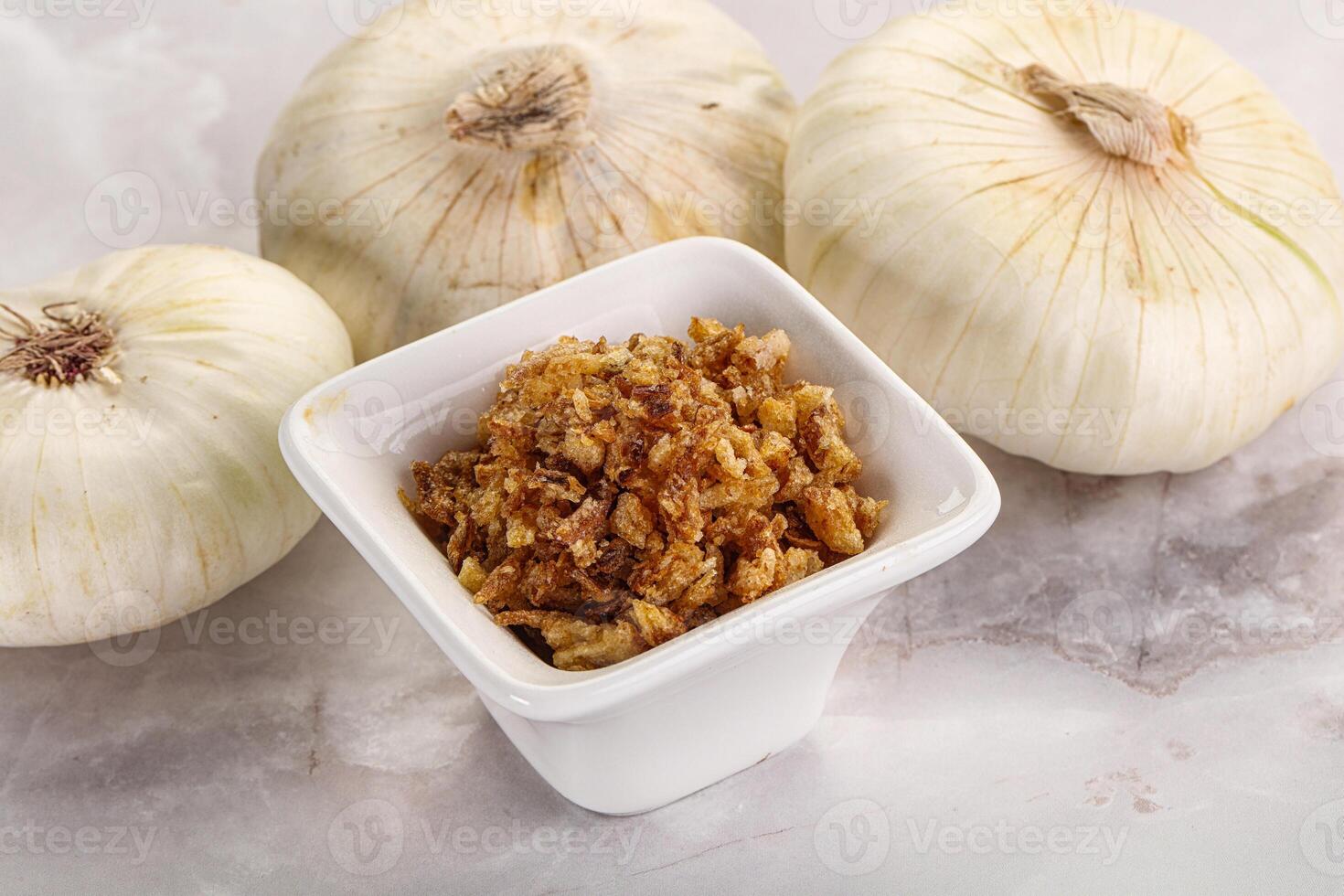 Dried roasted onion flakes for culinary photo