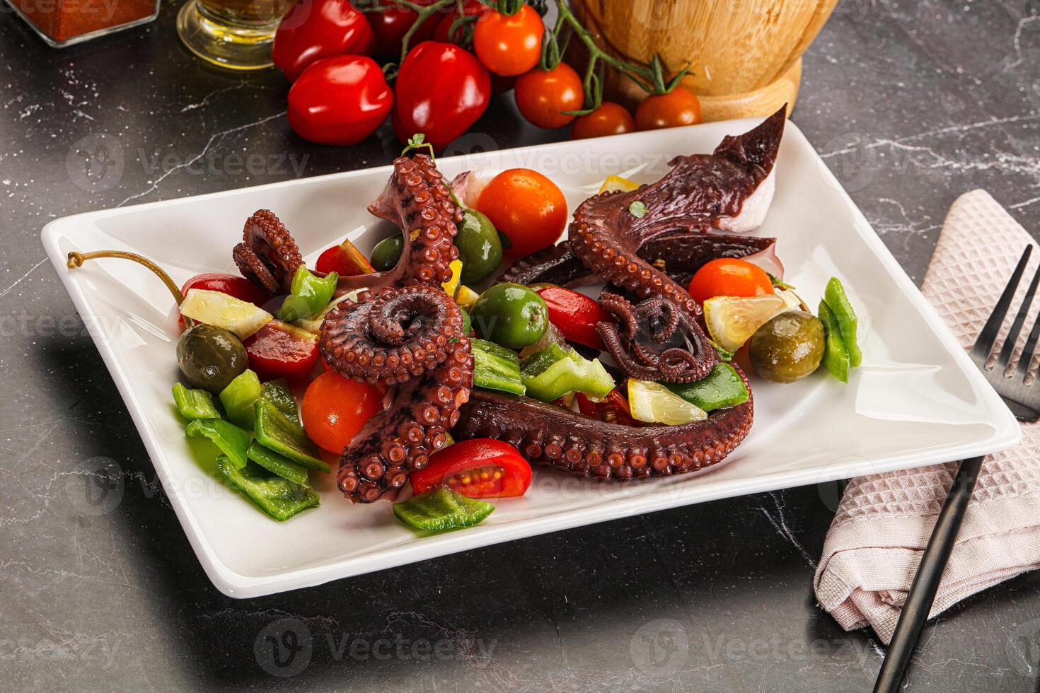 Salad with octopus tentacle and vegetables photo