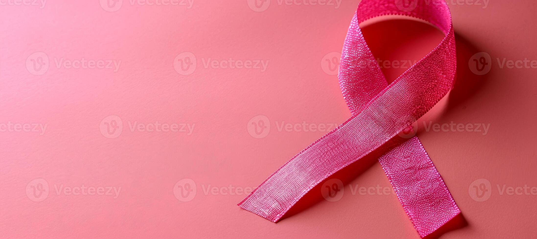 AI generated Breast cancer awareness month symbol with pink ribbon on pink background with copy space photo