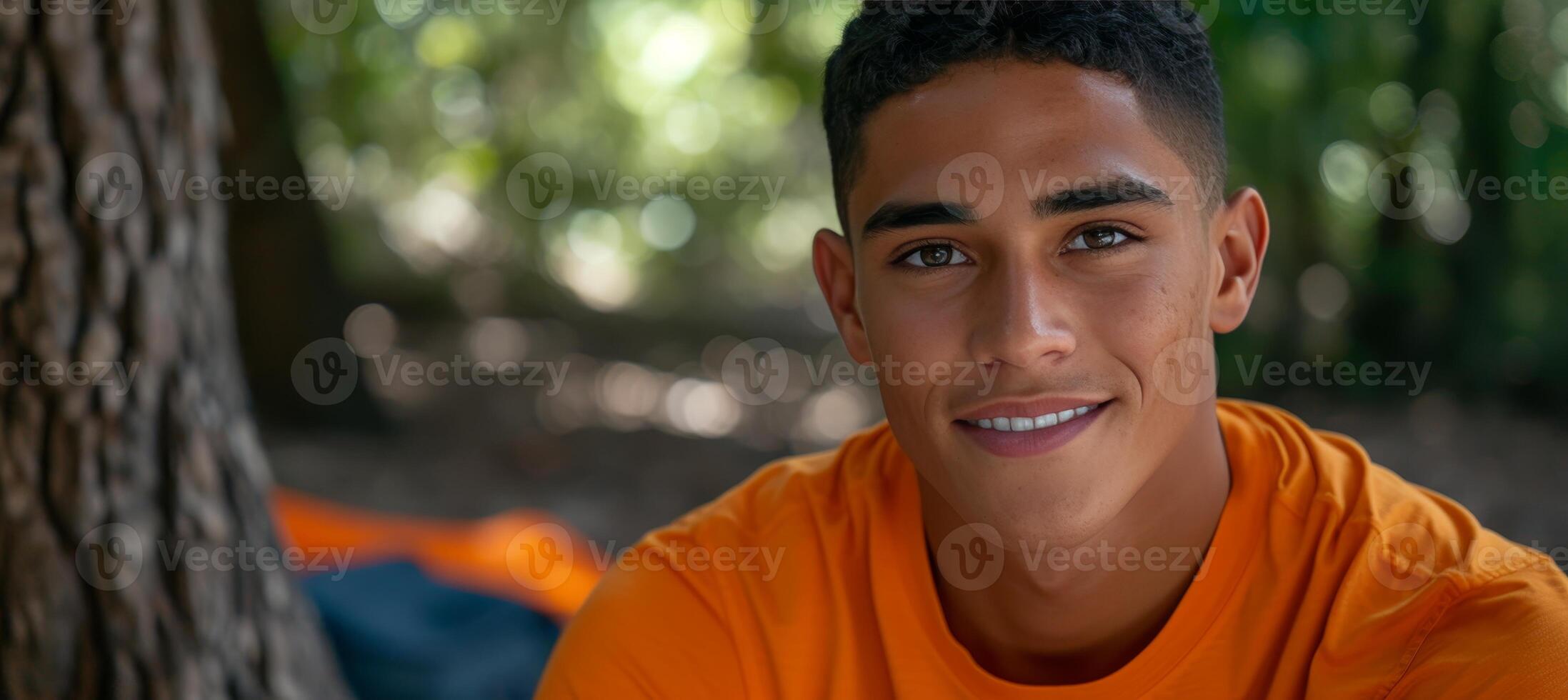 AI generated Joyful young man camping in stunning natural landscape with space for text placement photo
