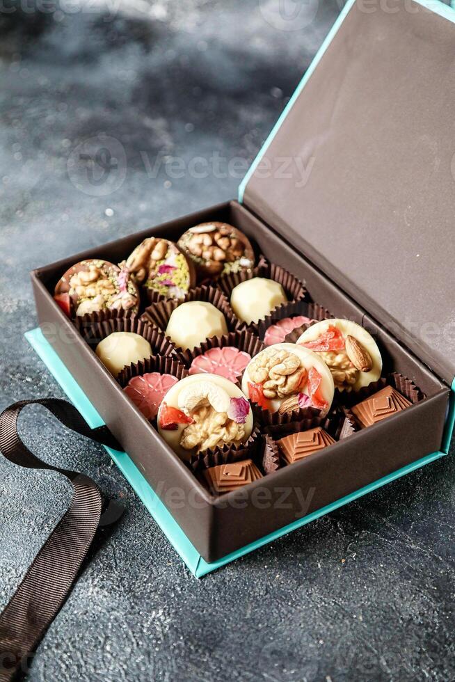 Assorted Chocolates Box on Table photo