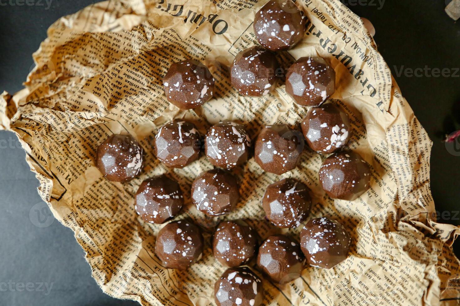 Assorted Chocolates Arranged on Top of a Piece of Paper photo