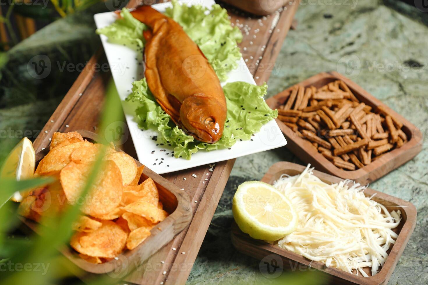 Wooden Tray Filled With Various Types of Food photo