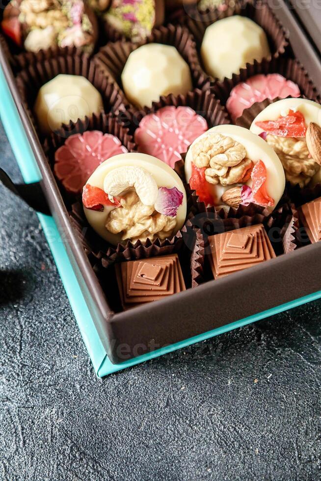 Assorted Chocolates Box Placed on Table photo