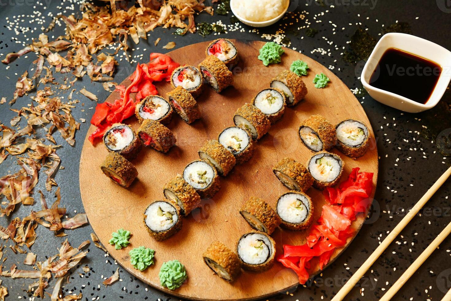 Wooden Plate With Sushi and Chopsticks photo