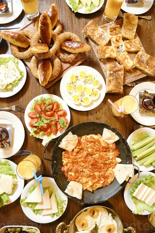 Abundant Spread of Food on Wooden Table photo