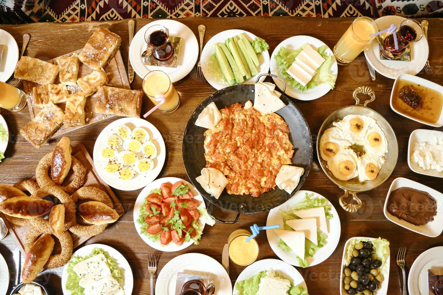 Abundant Wooden Table Displaying Variety of Delicious Food photo