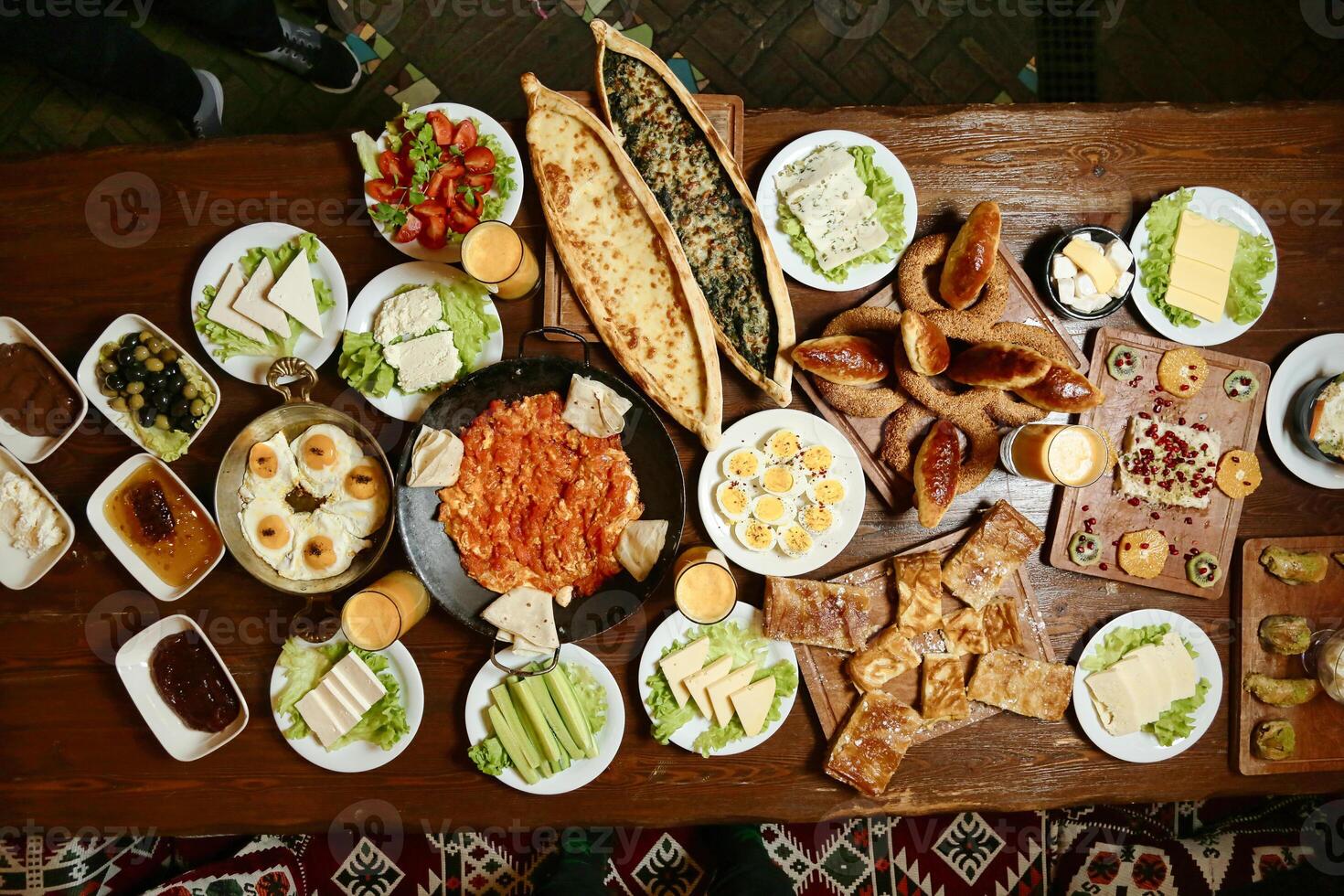 Wooden Table With Plates of Food photo