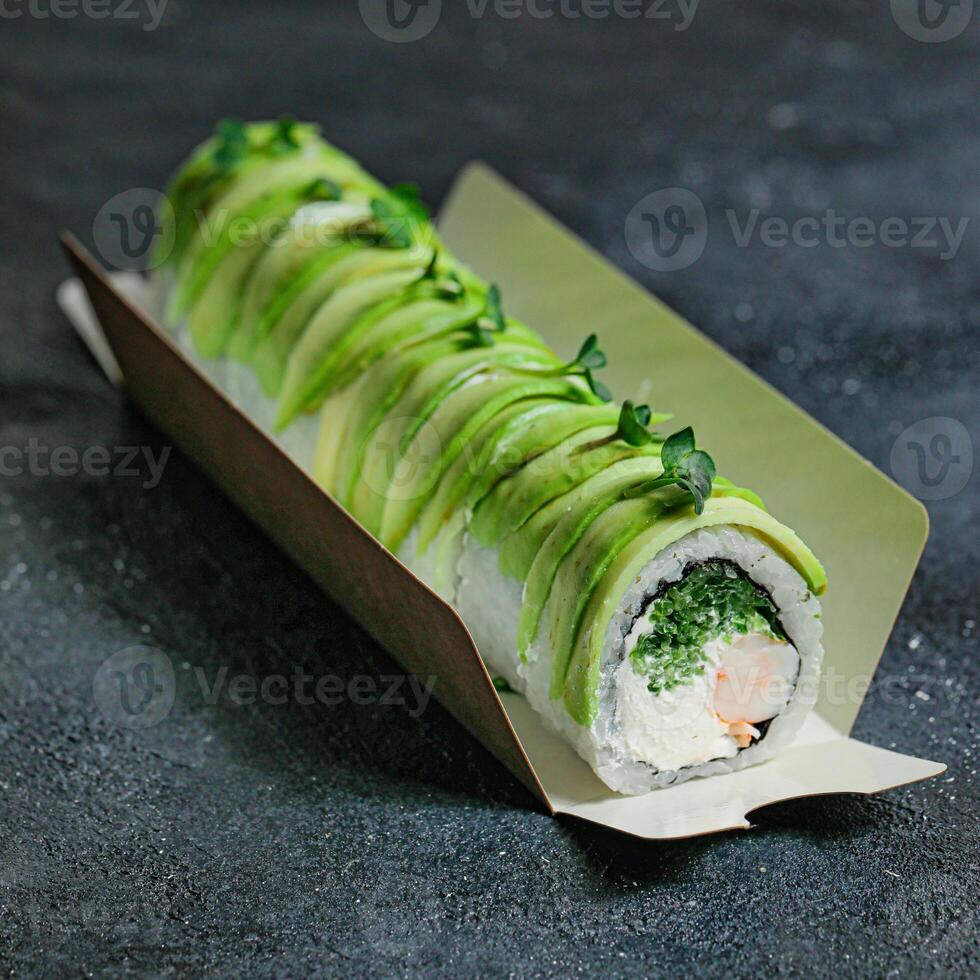 Fresh Sushi Roll on White Plate on Wooden Table photo