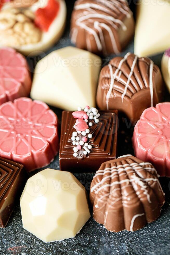 Assorted Types of Chocolates Spread on a Table photo