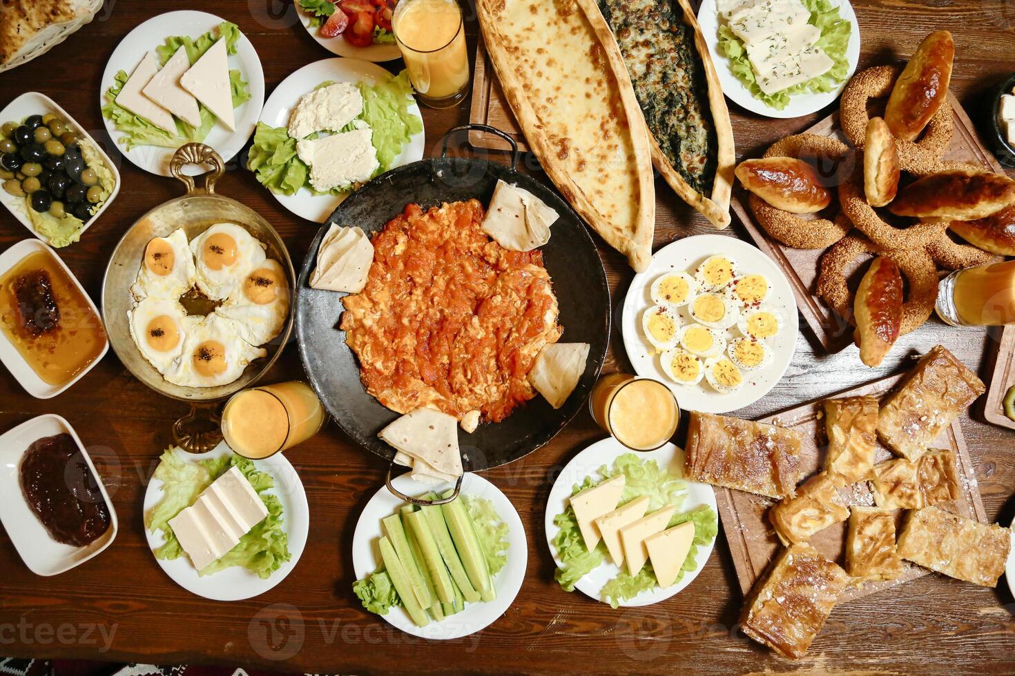 Wooden Table Adorned With Delicious Plates of Food photo