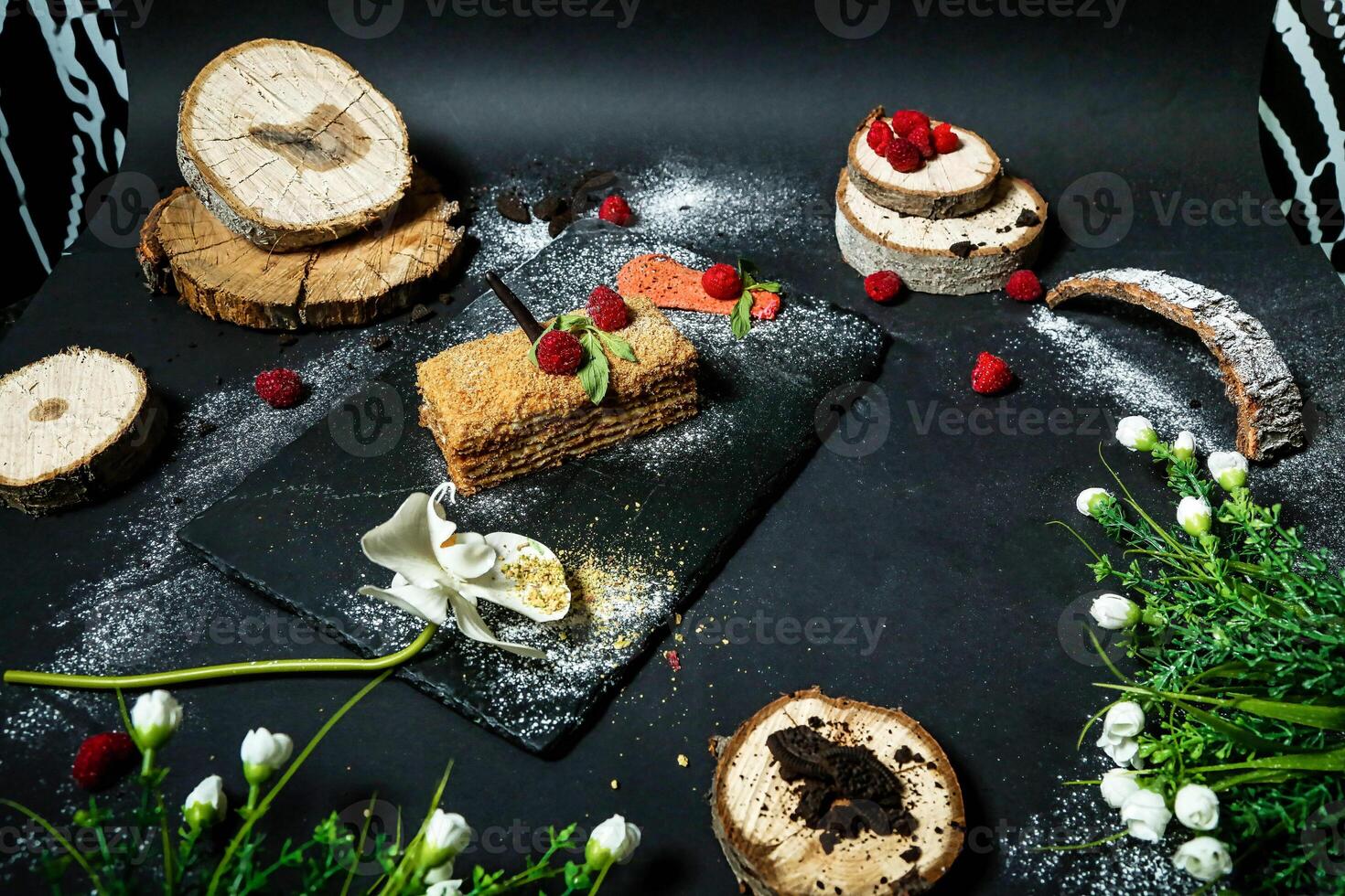 Table Adorned With Cake Slices and Flowers. photo