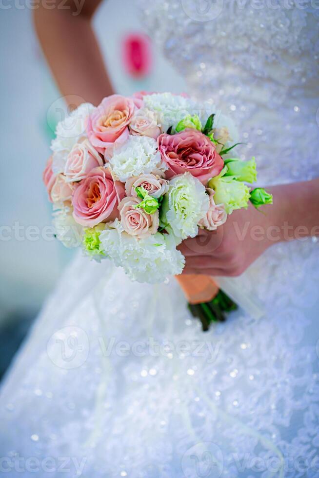 Bride Holding Pink and White Flower Bouquet photo