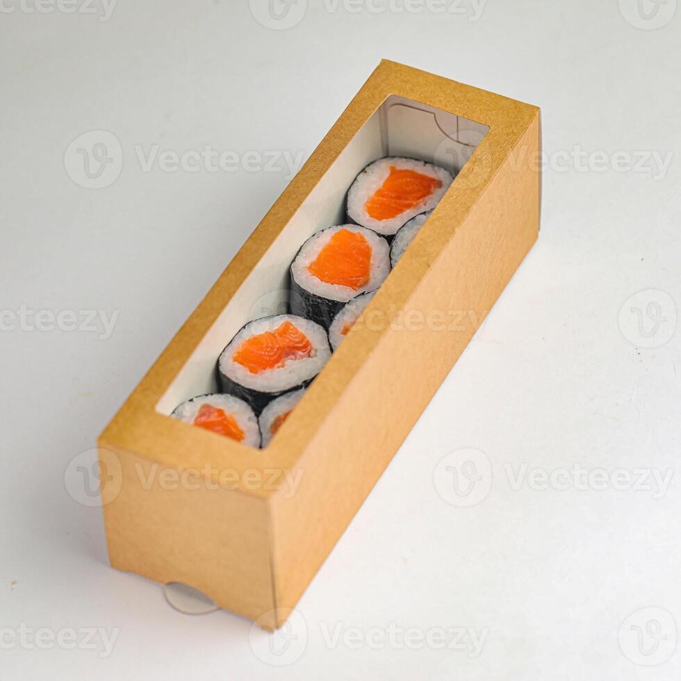 Four Sushi Rolls in Cardboard Box photo