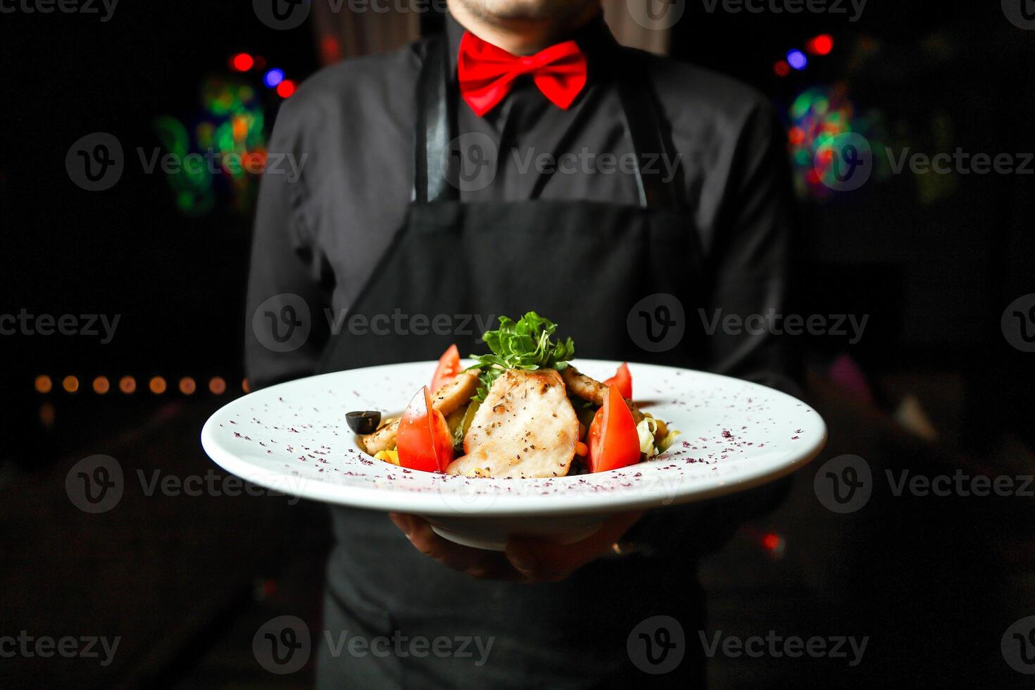 Man Holding Plate of Food photo