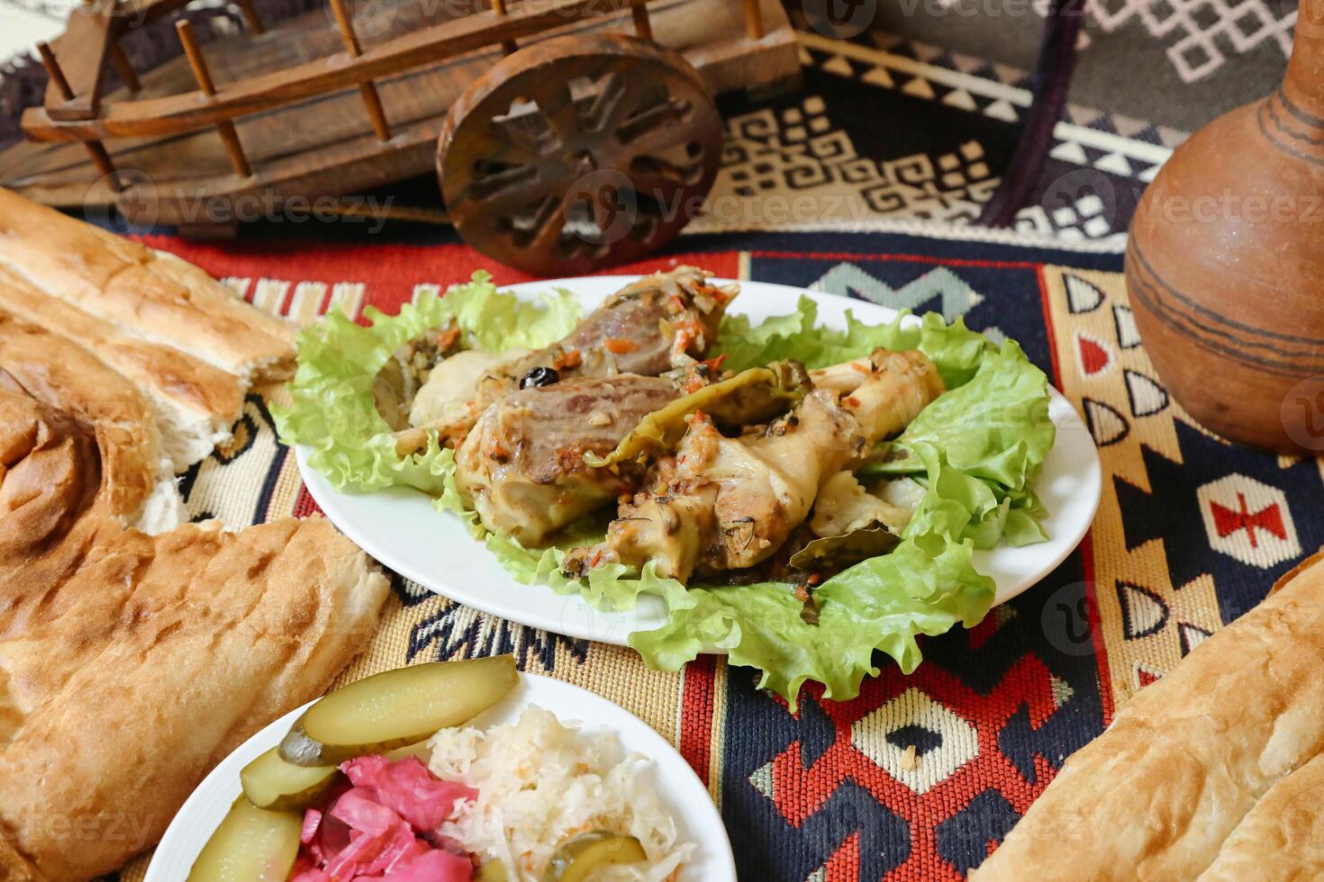 Table With Plates of Food on Rug photo