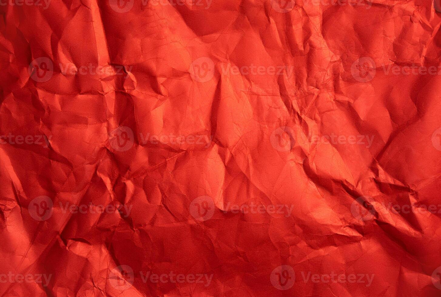 Crumpled red sheet of paper. Paper texture. Background for designers. Abstract background texture photo
