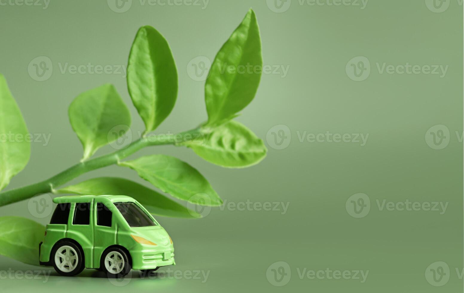 Ecology concept. Eco car on a green background. The concept of sustainable development. Copy space. photo