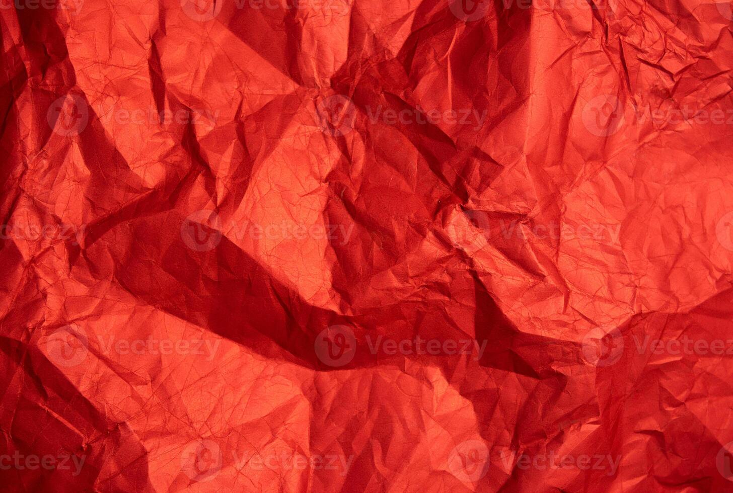 Crumpled red sheet of paper. Paper texture. Background for designers. Abstract background texture photo