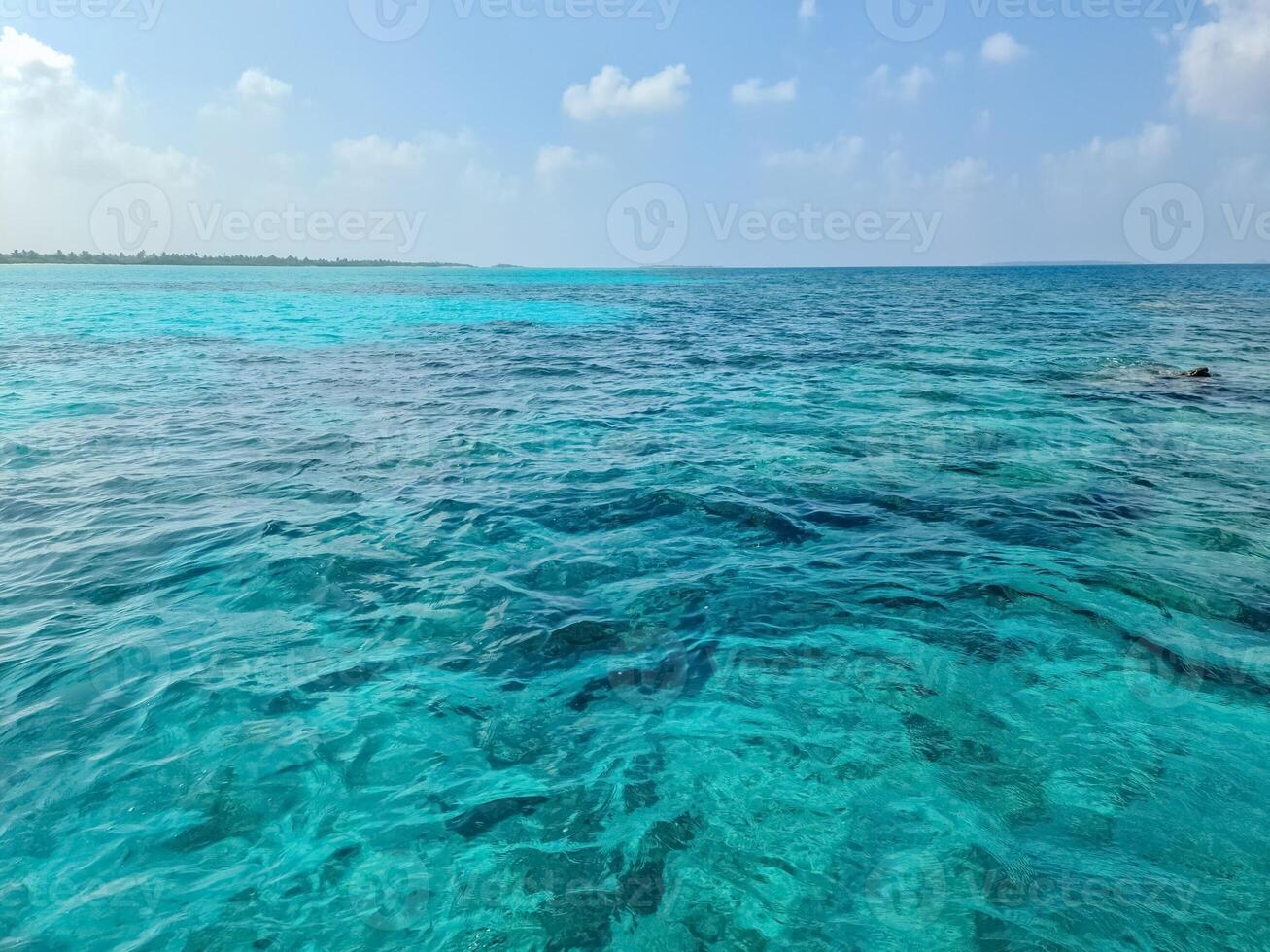 On vacation on the dream beach of the Maldives with the unique turquoise waters of the Indian Ocean. photo