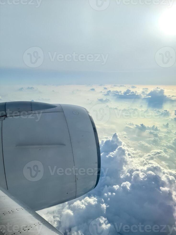 View from an airplane of the engine and the clouds over the Maldives. photo
