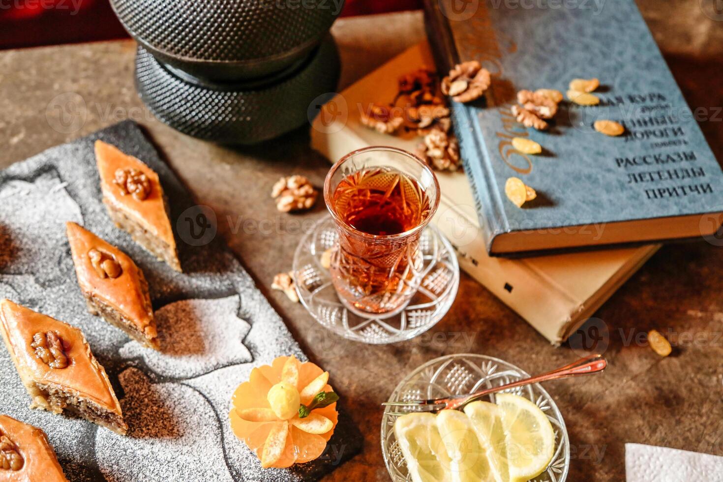 Wooden Table With Cup of Tea and Book photo