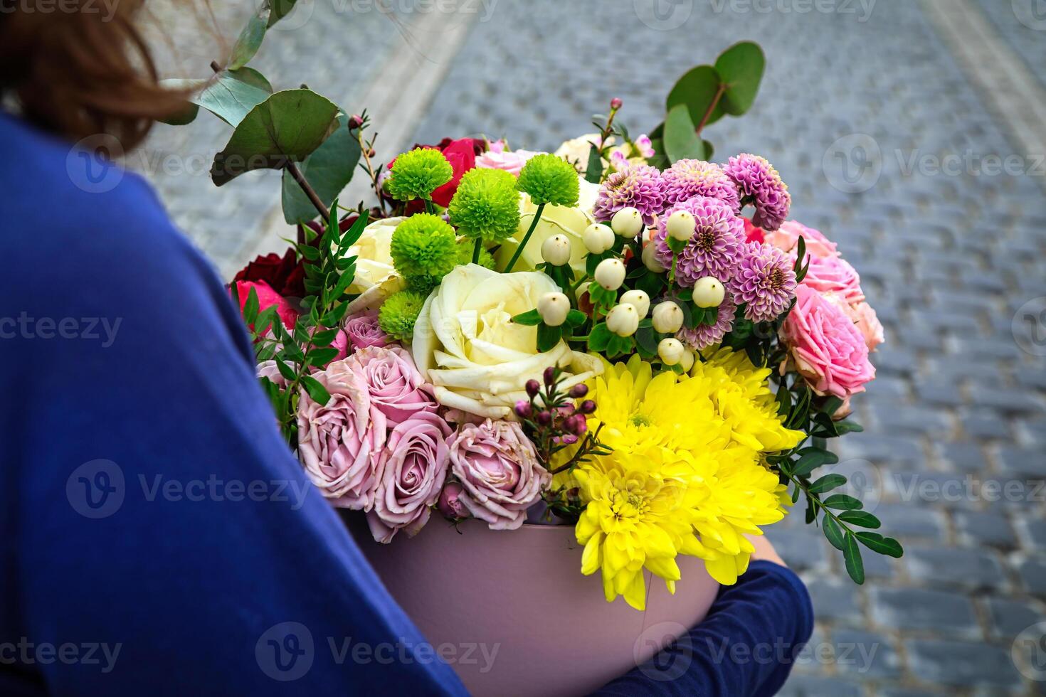 Woman With Large Bouquet of Flowers photo