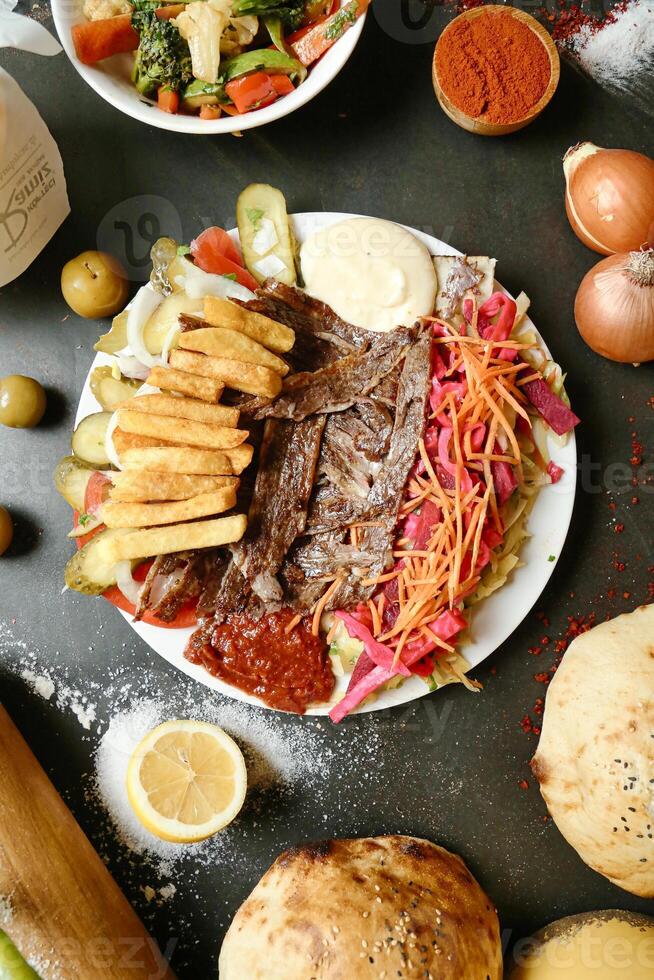 Table With Assorted Plated Food and Bread photo