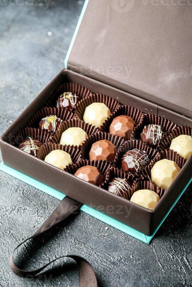 Assorted Chocolates Box on Table photo