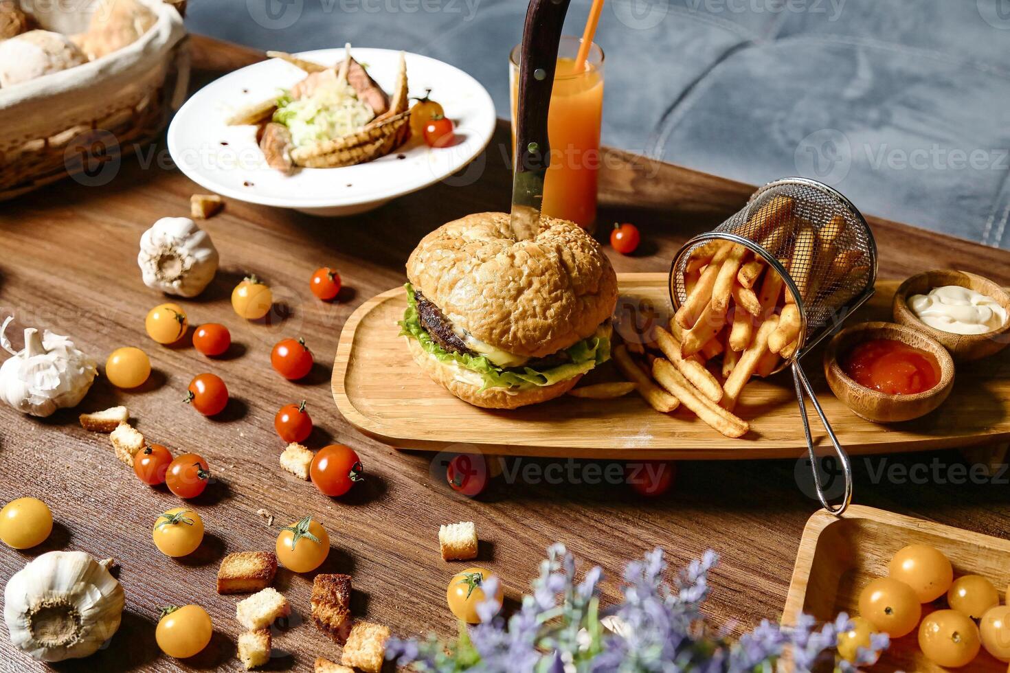 Wooden Table Adorned With Assorted Plates of Food photo