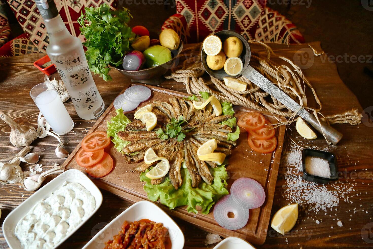 Wooden Table With Assorted Bowls of Food photo
