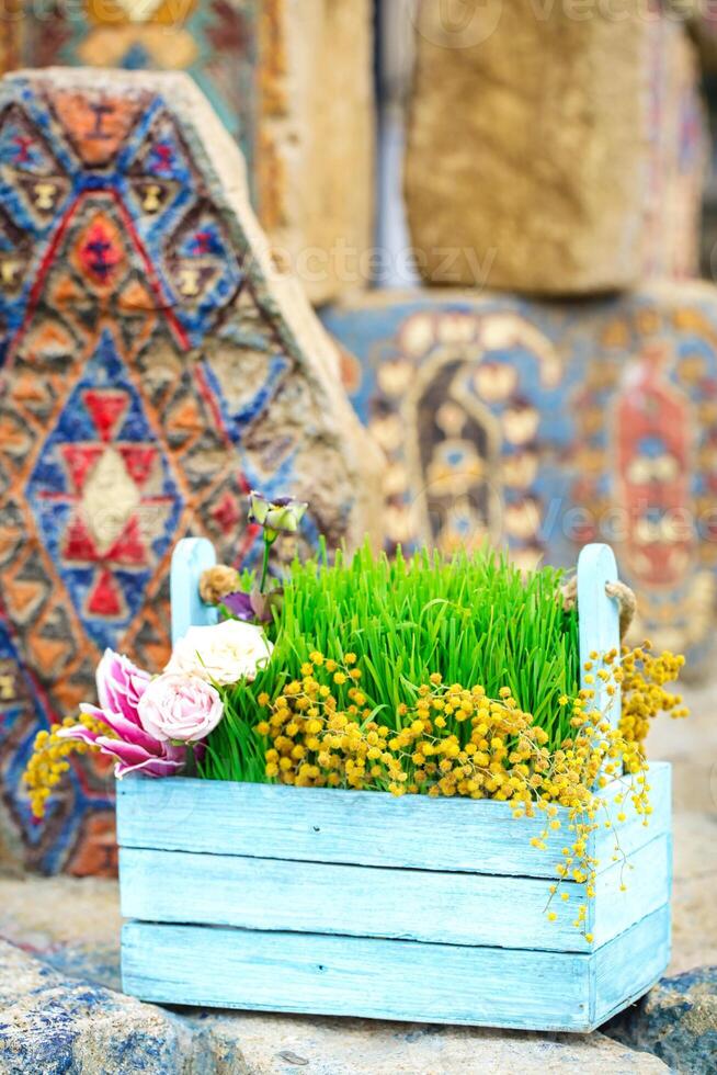 Wooden Box Filled With Grass and Flowers photo