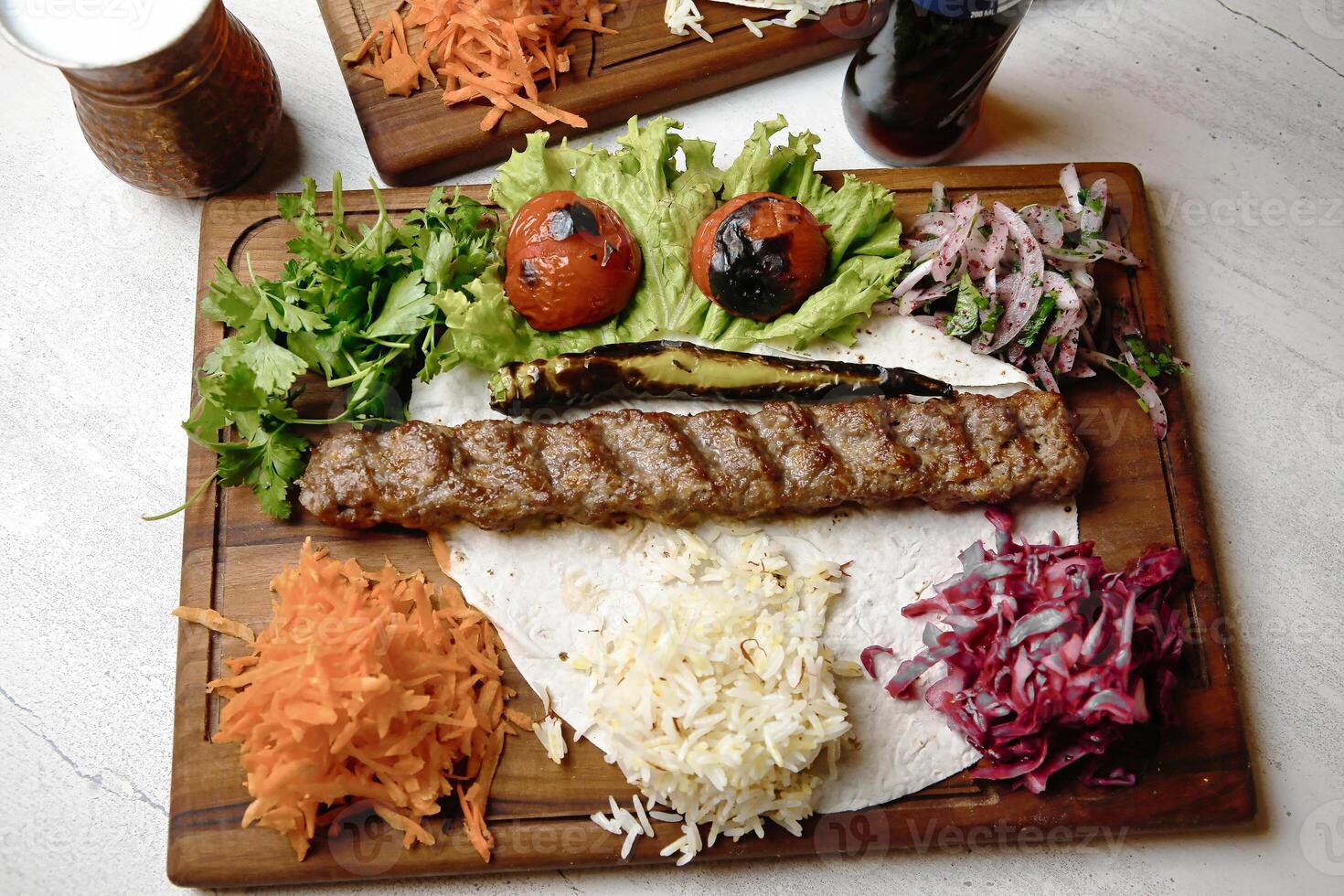 Wooden Cutting Board With Assorted Meats and Fresh Vegetables photo