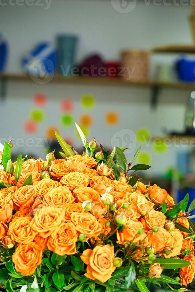 Vibrant Orange Roses Adorning Table, Copy Space photo