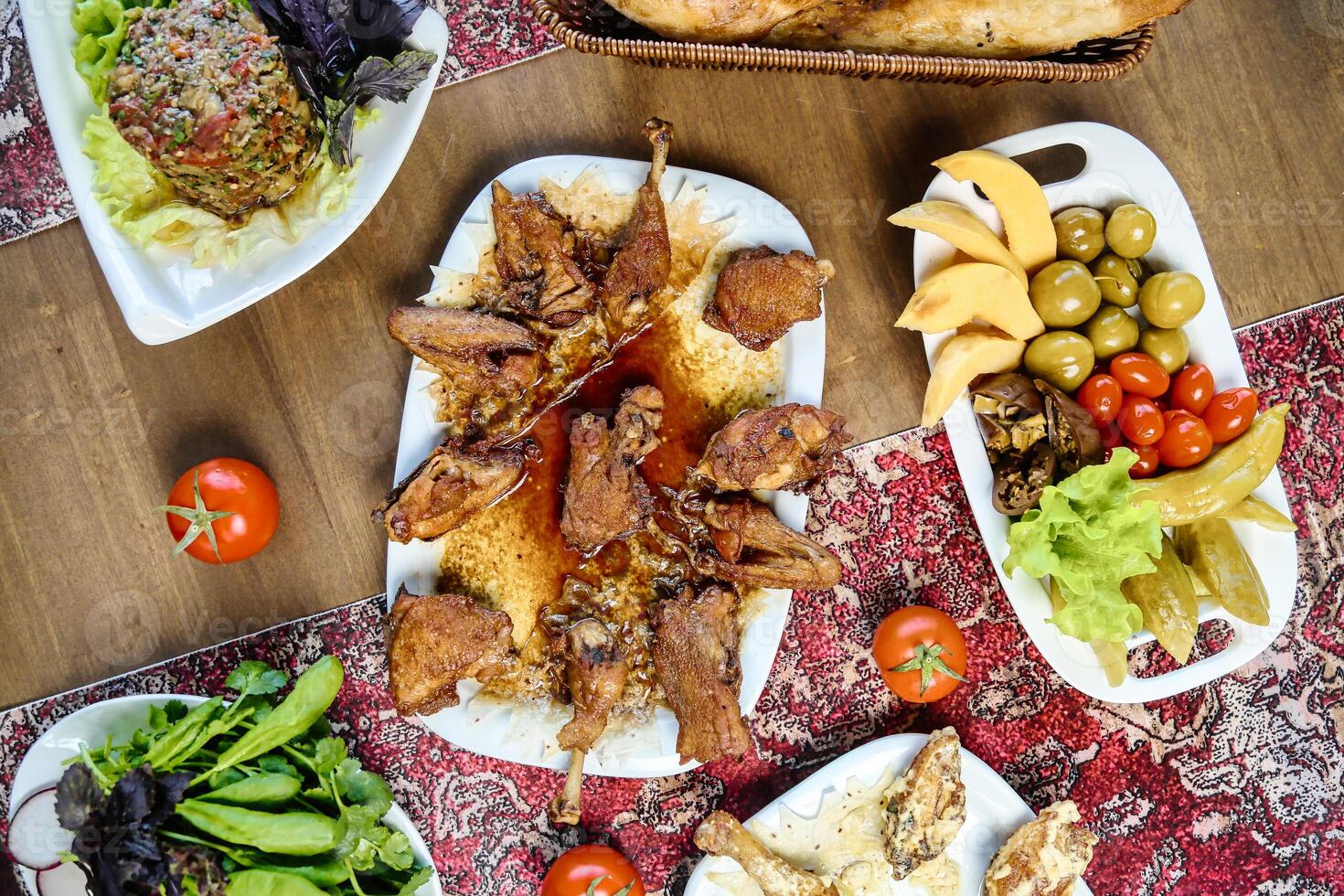 Table With Assorted Plates of Food photo